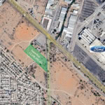 Superficie de terreno en venta de 13,106.09 m² en zona comercial cerca de Ford, ideal para desarrollo inmobiliario o comercial, con excelente ubicación y accesibilidad.