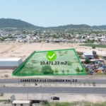 Amplia parcela de bienes raíces comerciales en venta con fácil acceso a la carretera a La Colorada, ideal para desarrollo industrial o comercial, con 10,471 m² en una ubicación estratégica.