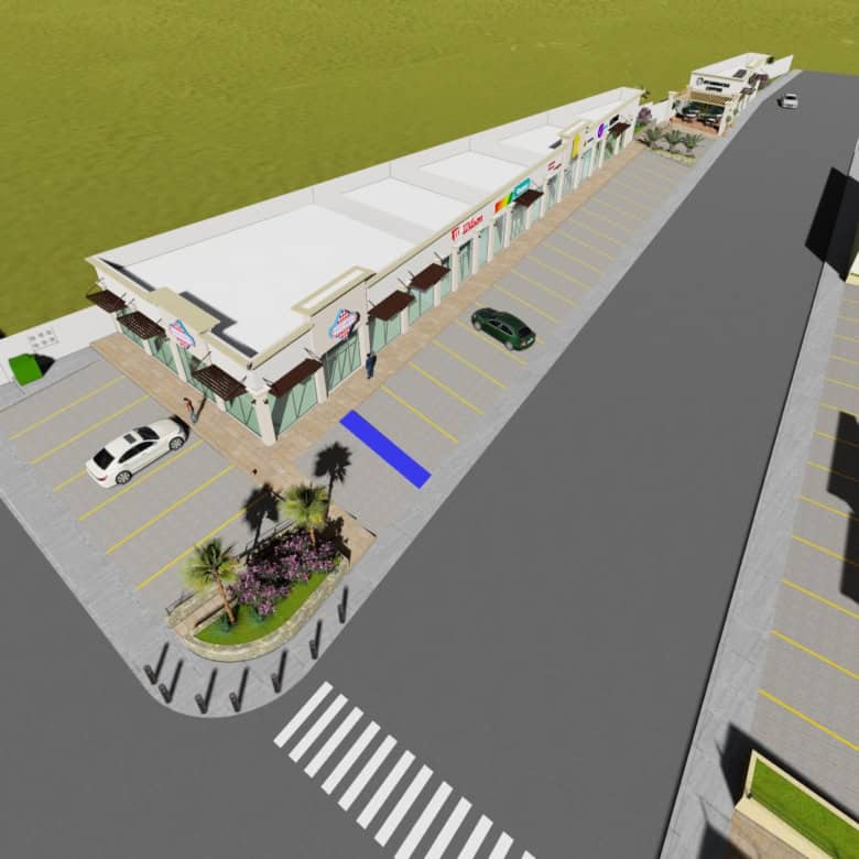 Alto: Fachada de centro comercial con locales en venta, estacionamiento y área peatonal, ideal para inversión en bienes raíces comerciales en Fompo.