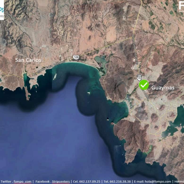 Vista satelital de Guaymas y San Carlos, Sonora, con detalles de acceso a zonas costeras y principales vías de comunicación para propiedades comerciales.